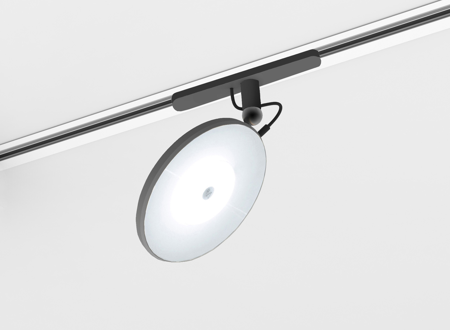 Einbaustromschienensystem AVVENI Stromschiene mit einem dezenten Adapter und einem tellerförmigen beweglichen AVVENI Leuchtenkopf.