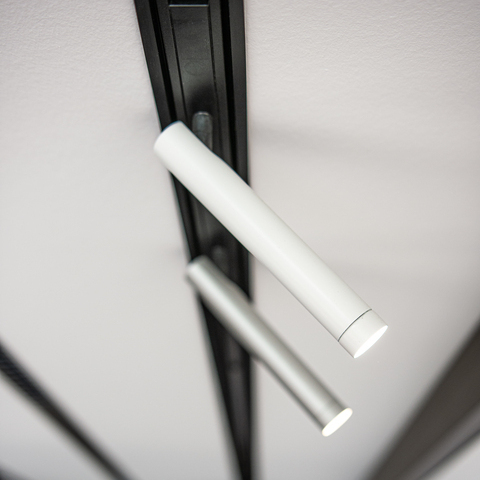 PALADIO TRACK recessed track light with FINO SPOT 2 Recessed power track (PALADIO TRACK) with two FINO SPOT 2 movable cylindrical spotlights, one in white and one in silver.