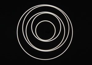 View of the TOCCATA 1900 ring pendant light from below View from below of 5 interconnected illuminated rings of the TOCCATA ring light object.