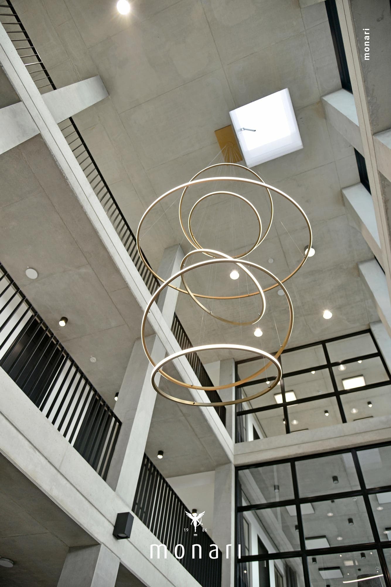 Chandelier made of SLIM-OUT ring lights in the entrance foyer of MONARI