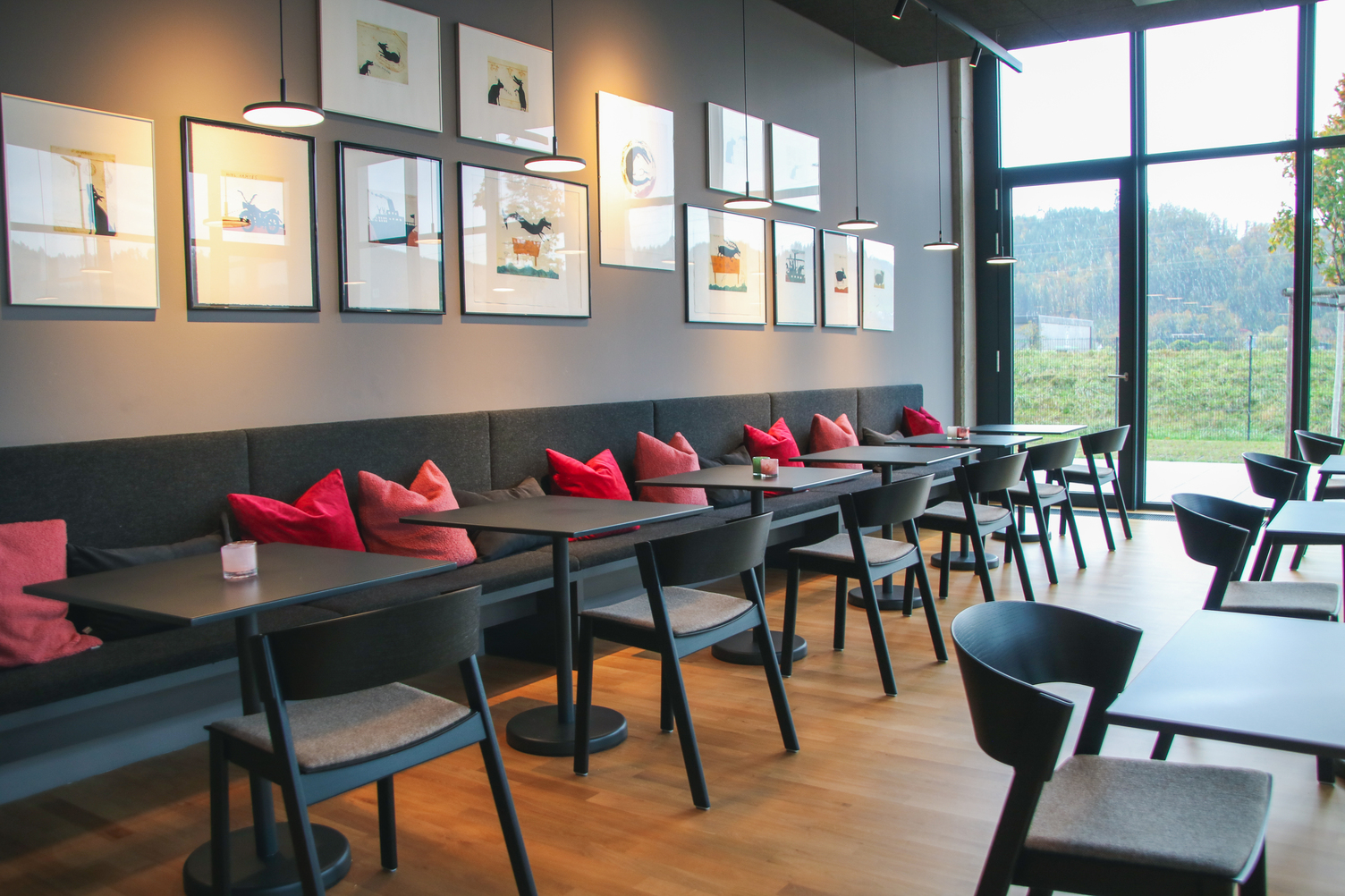Streit Break Room - Featuring Paladio Track System and Avveni Pendant by Sattler Cafeteria area at Streit with modern seating and Sattler's Evolution Spot in combination with Avveni Pendant 1 in Paladio Track system luminaire used from a different viewing angle.